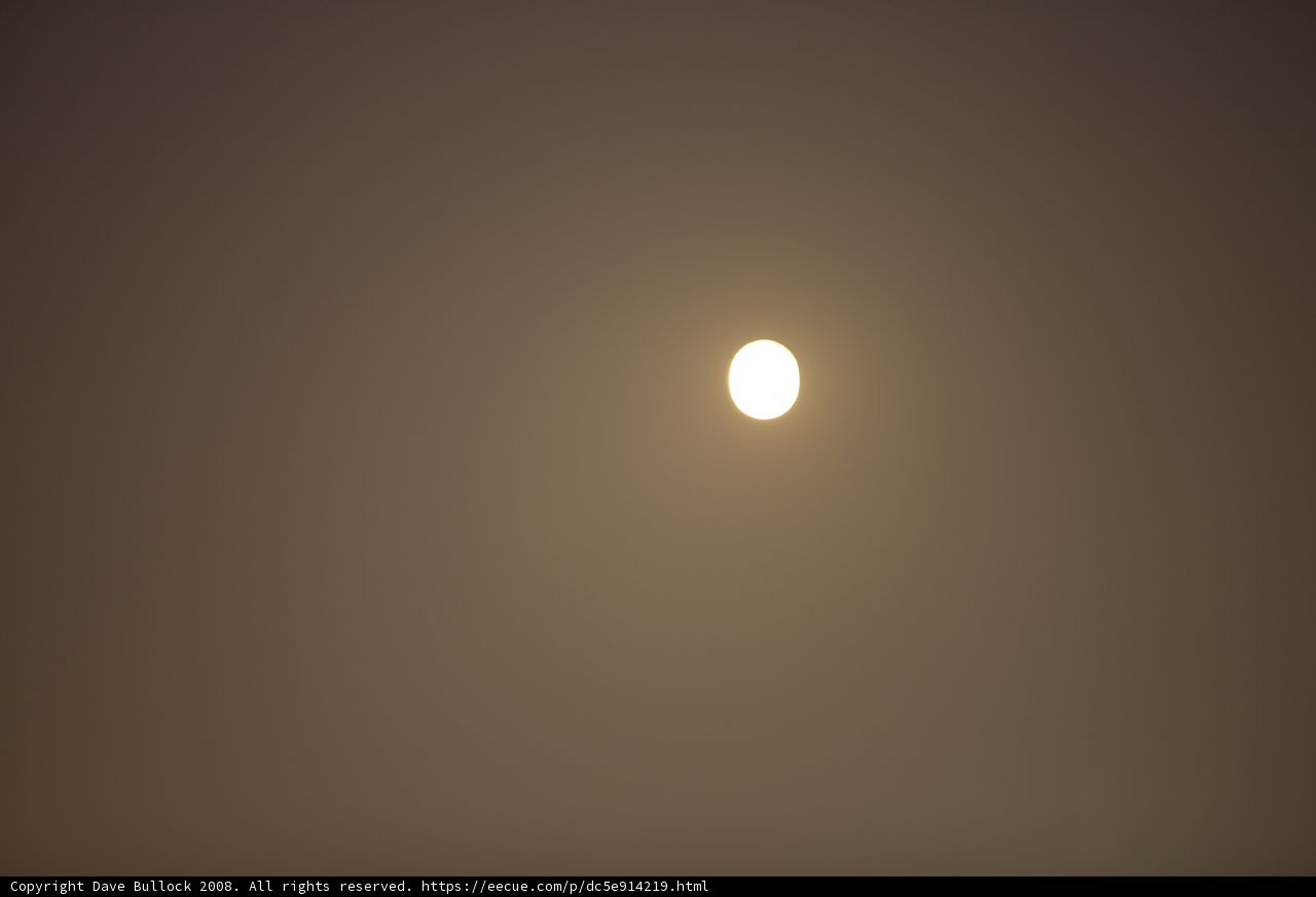 Majestic Full Moon Shrouded in Fog