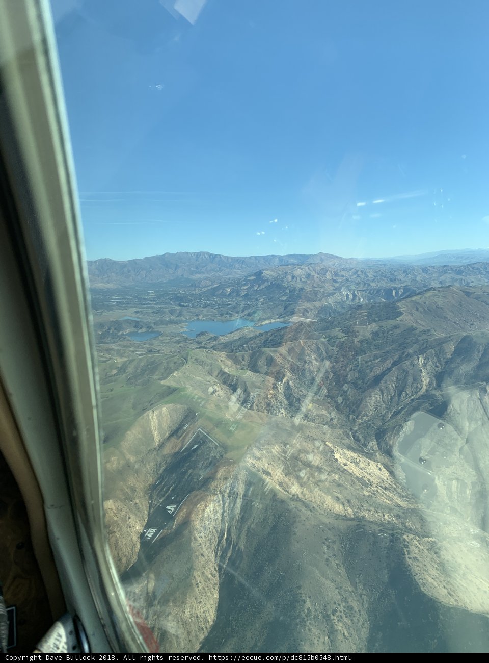 A Bird's Eye View of Majestic Mountains and Serene Valley