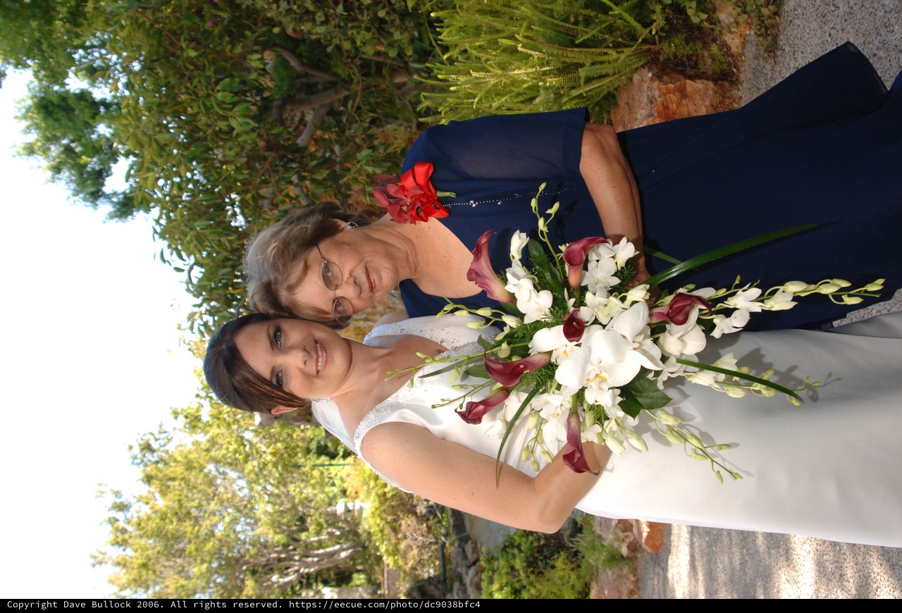 Bride and Elder Woman Share Wedding Day Bouquet