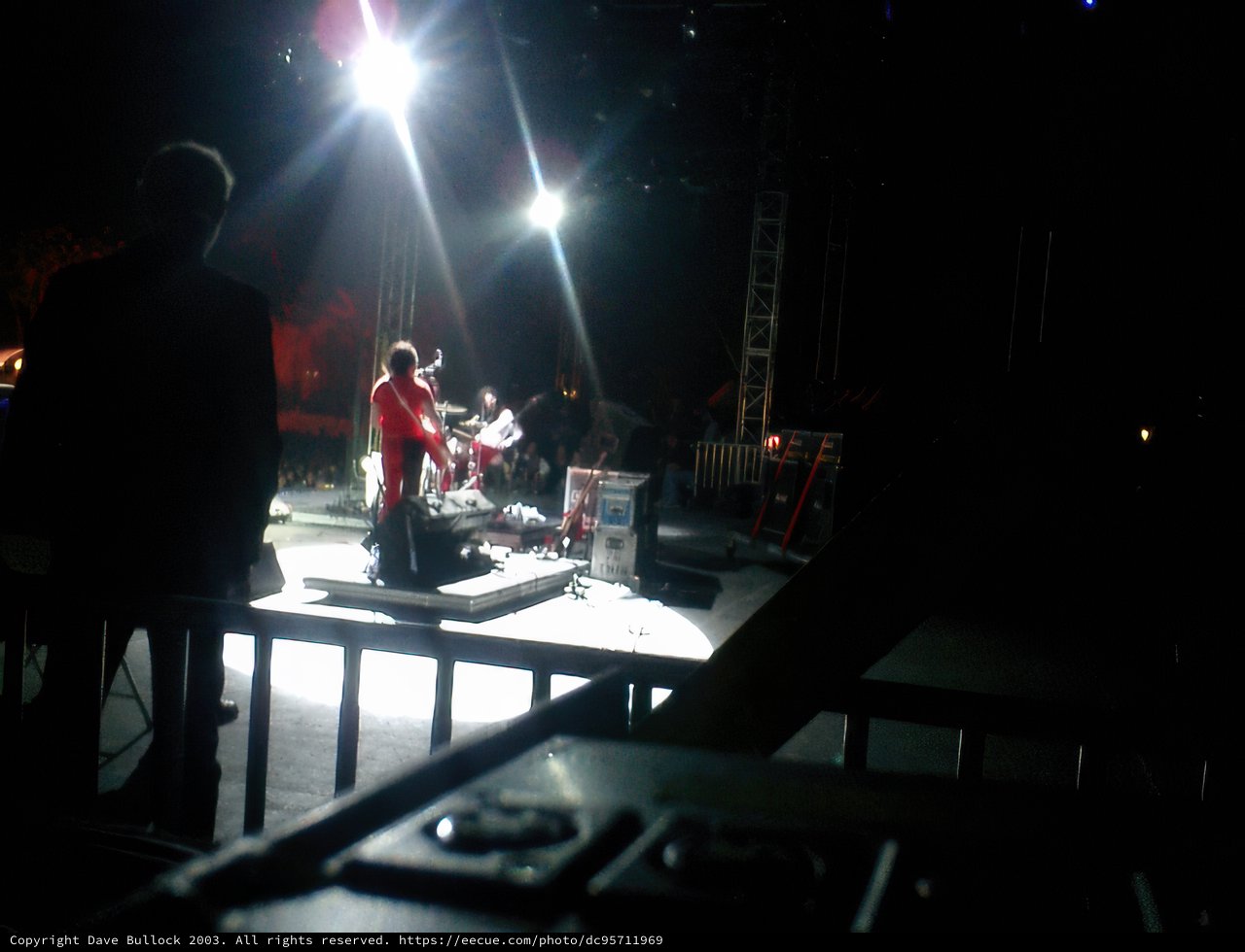 Spotlight on the Red-Shirted Guitarist