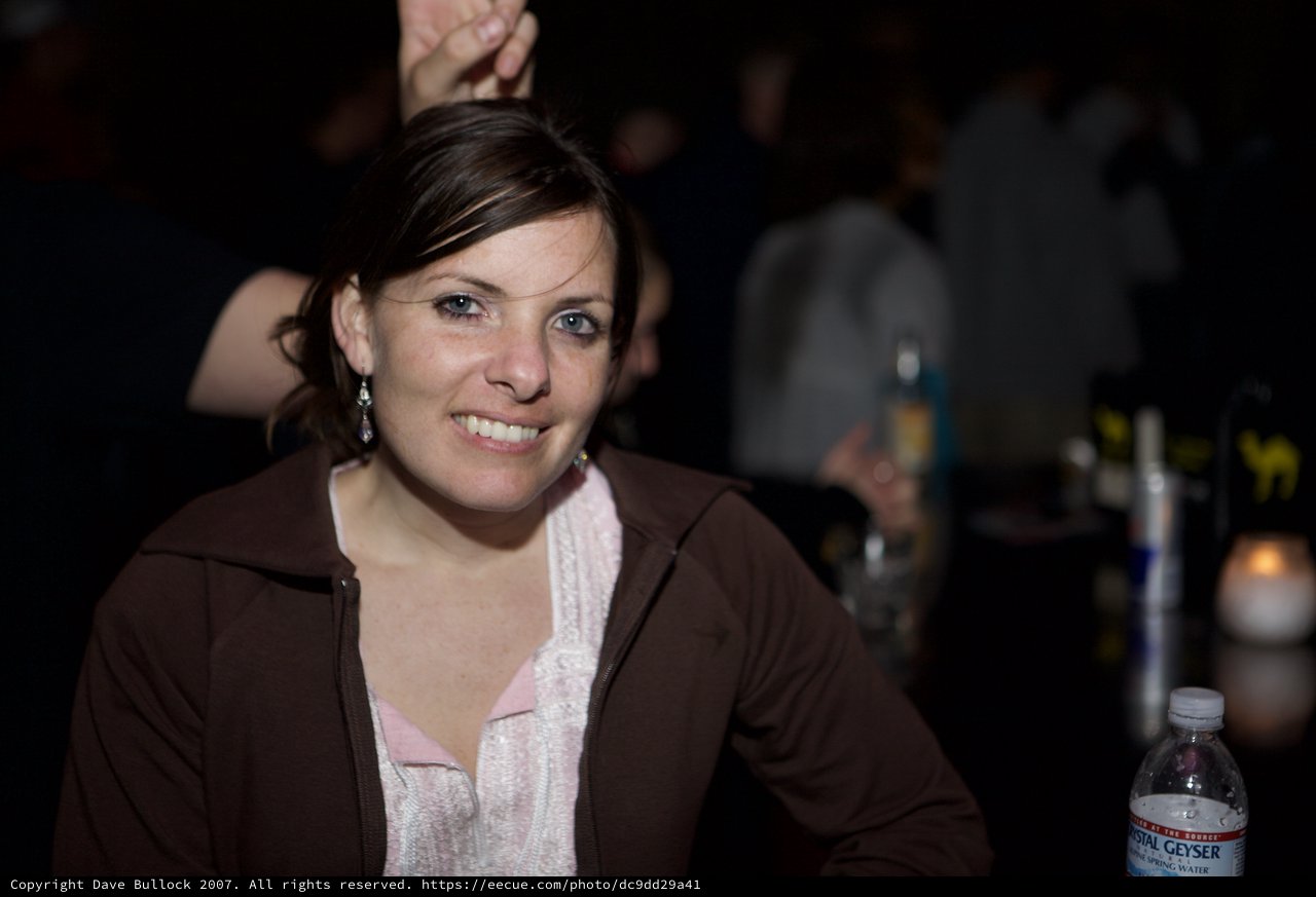 Woman Smiling at Nightclub Event in 2007