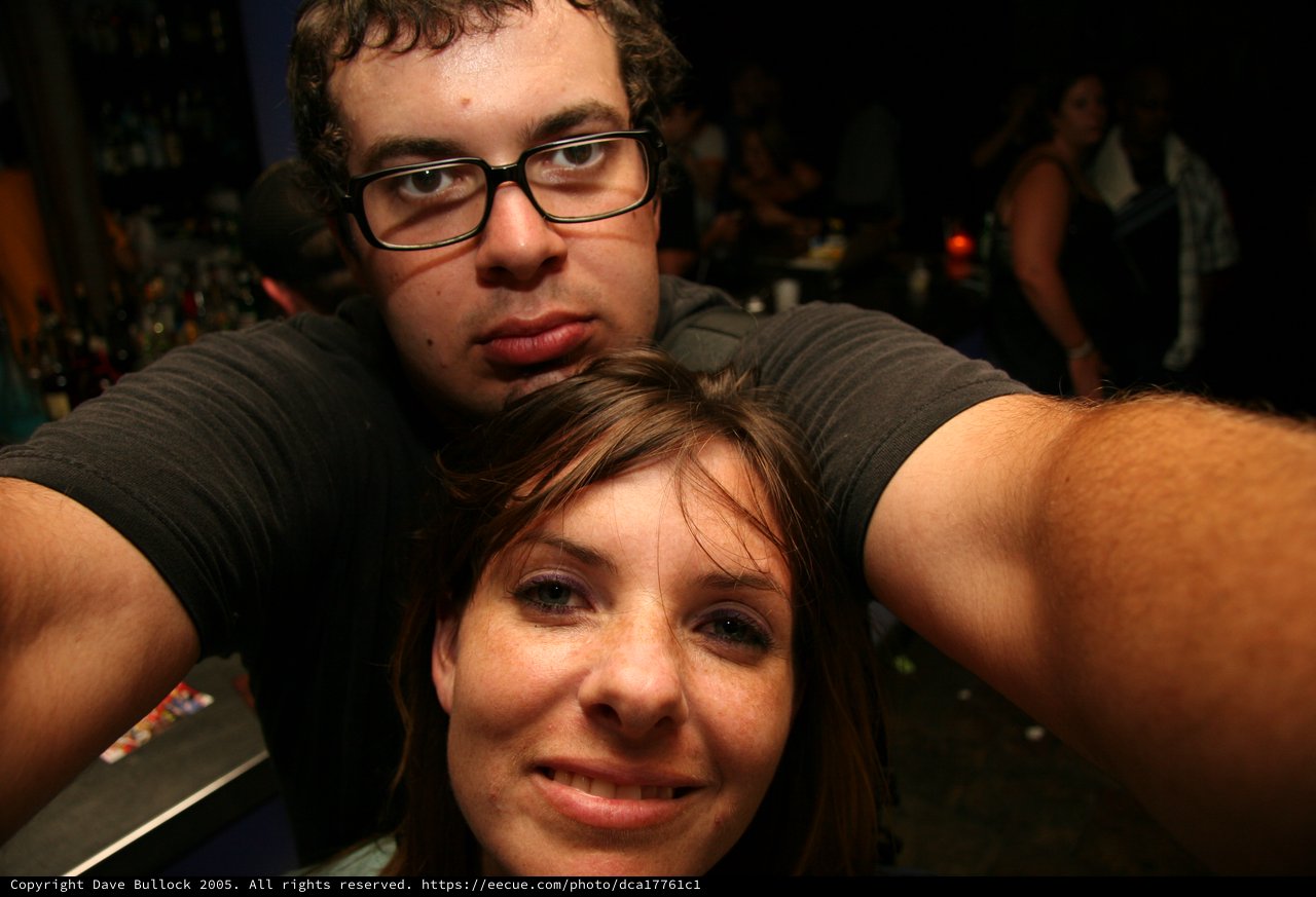Bar Selfie Duo with Arms Stretched Wide