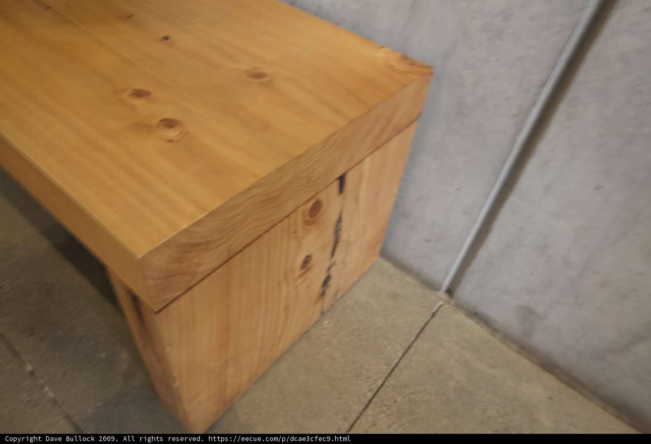 Rustic Wooden Bench Against Wall