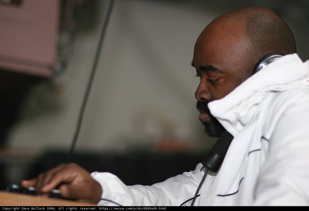 White-Jacketed Man with Headphones