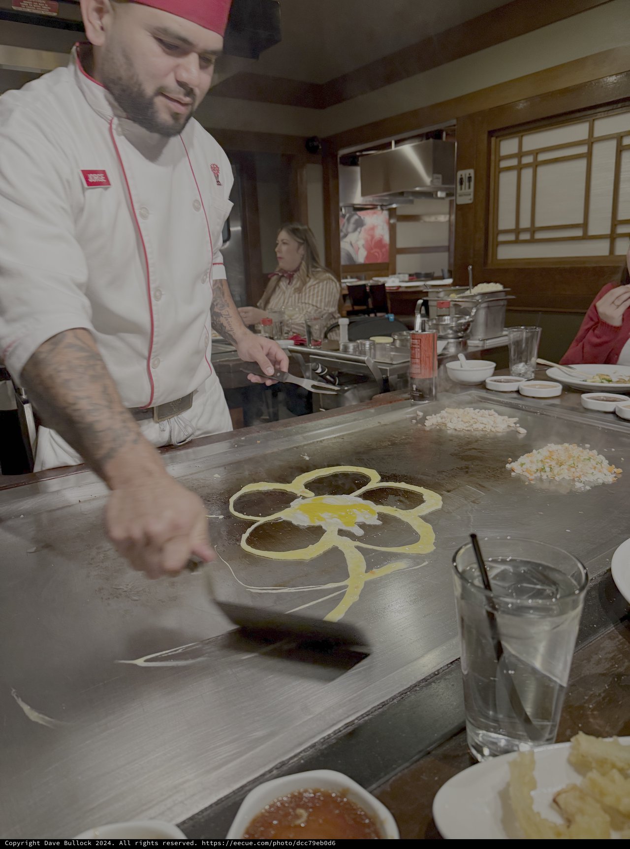 Chef Demonstrates Teppanyaki Cooking with Flower Design