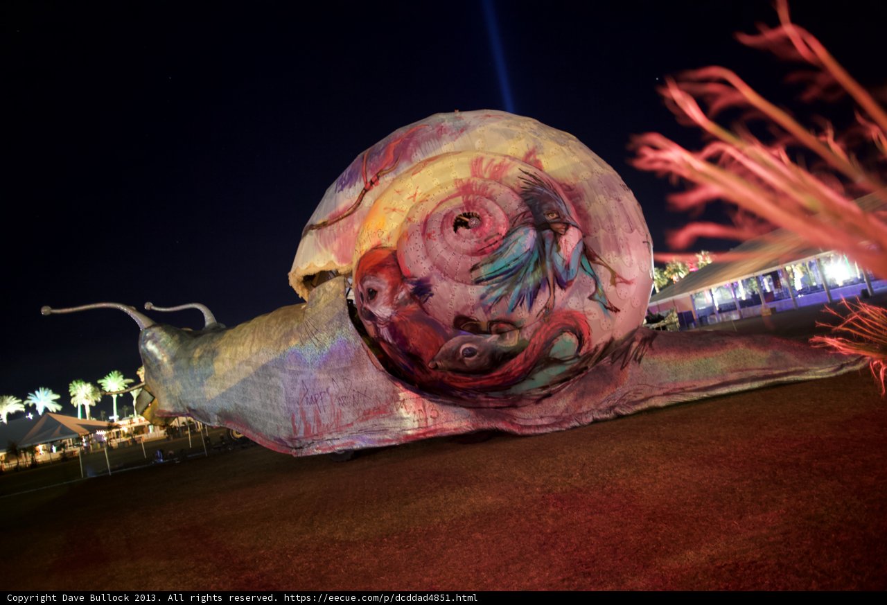 Glimmering Snail Sculpture in the Night Sky