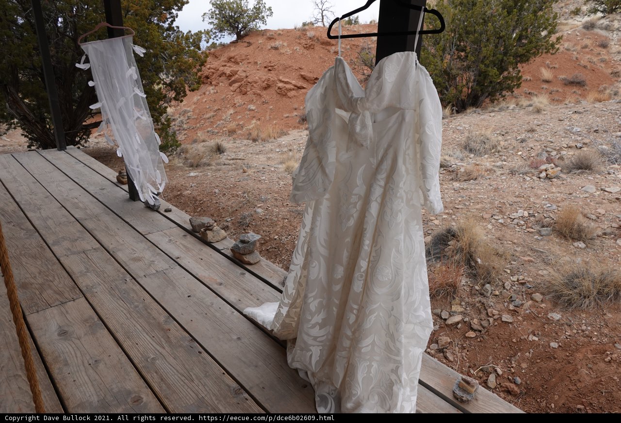 Elegant Wedding Gown on Wooden Porch
