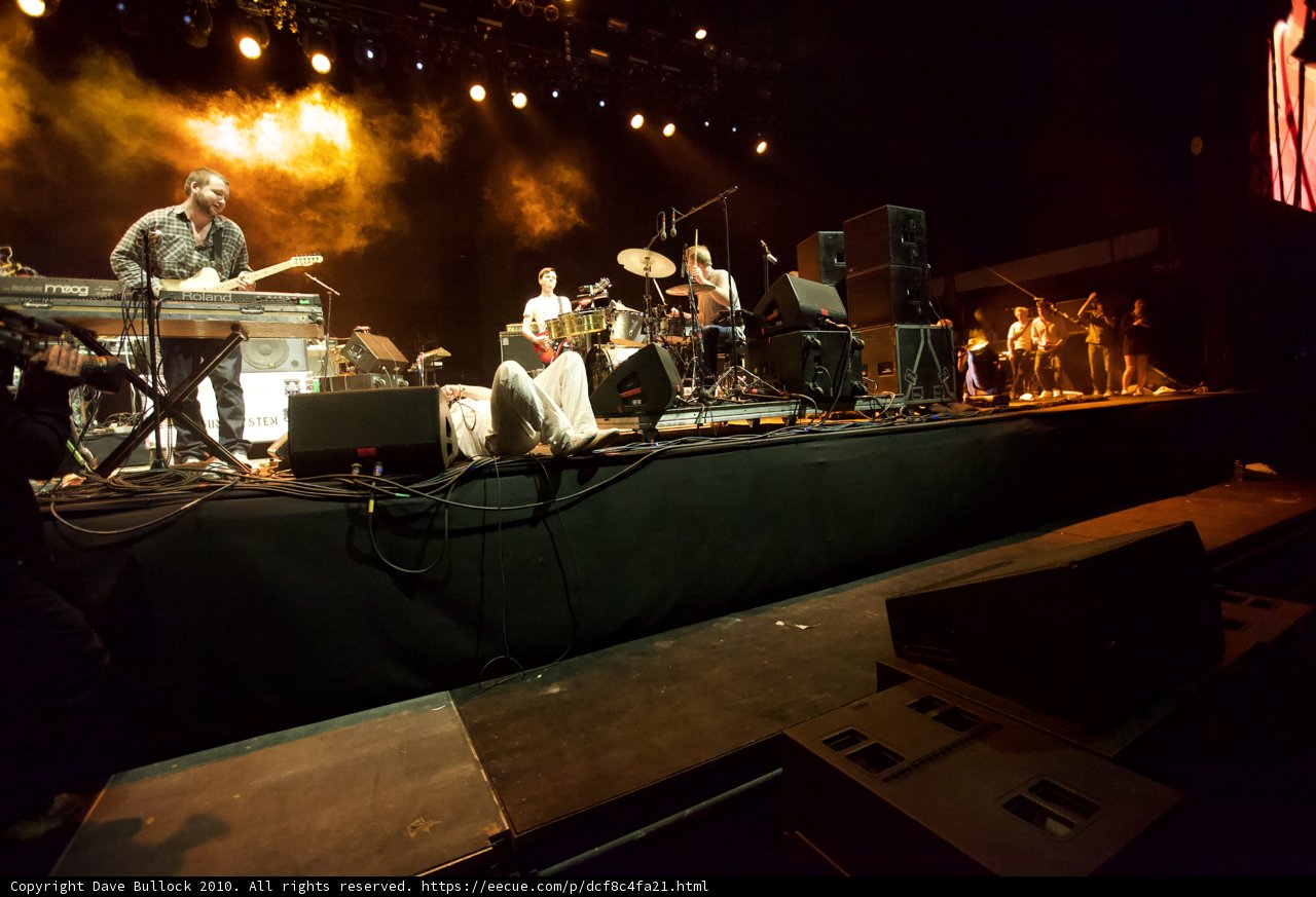 Musical performance under spotlight and smoke