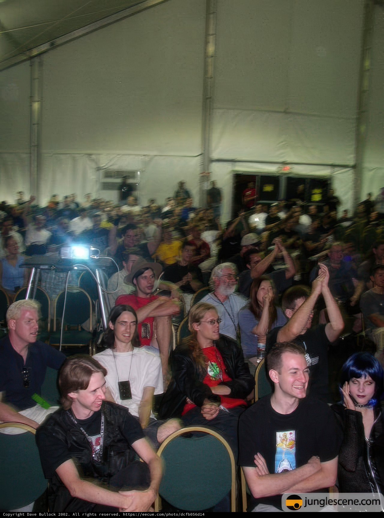 Tent Crowd Enthralled by Video