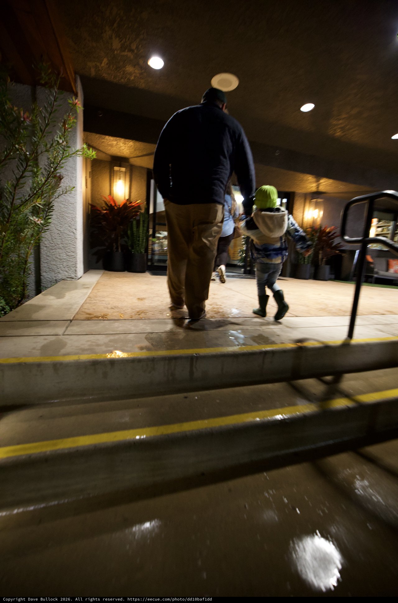 Father and Child Walking Home on Winter Evening