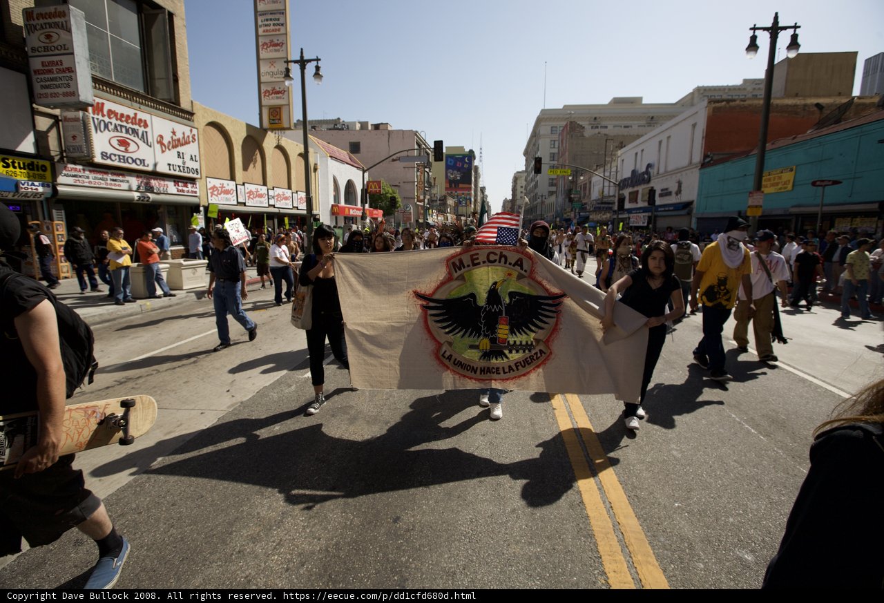 May Day Marchers Hold High the Flag