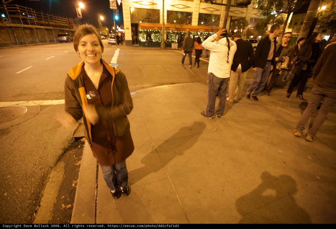 Joyful Woman Celebrating on City Street at Night