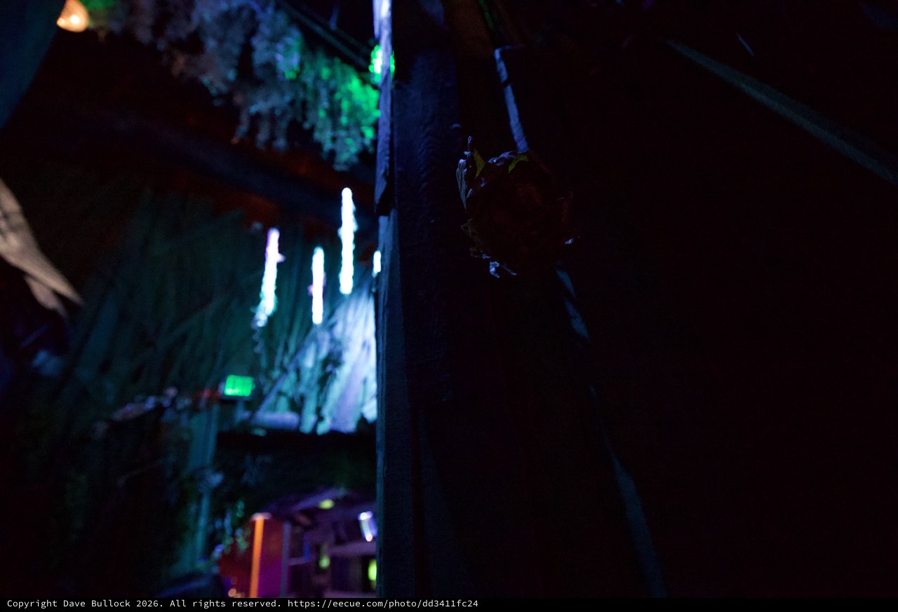 Neon-Lit Underground Passage with Silhouetted Figure