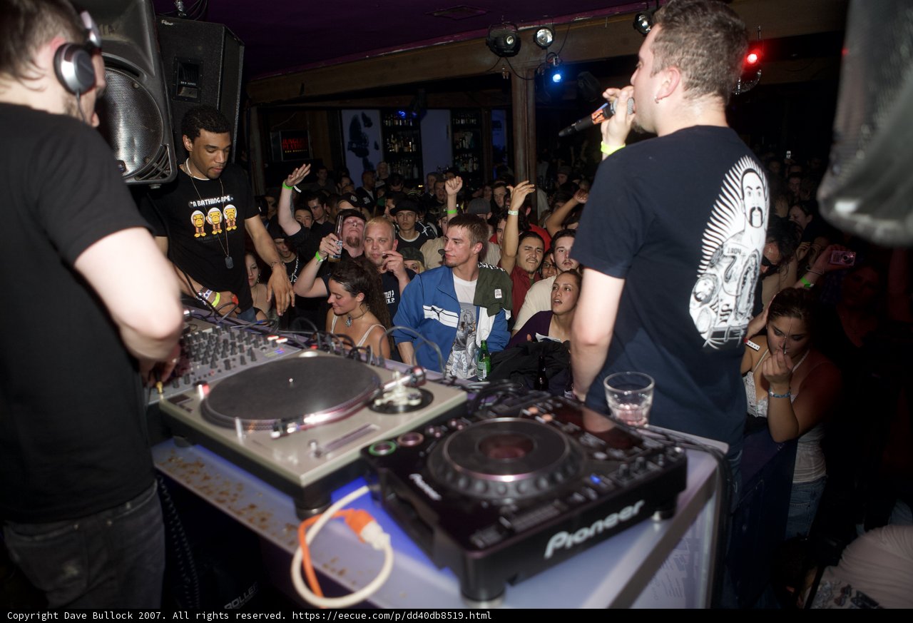 Partygoers Rock Out with DJ Equipment