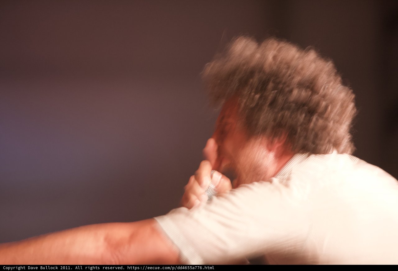 Blurry man resting his hand on his face