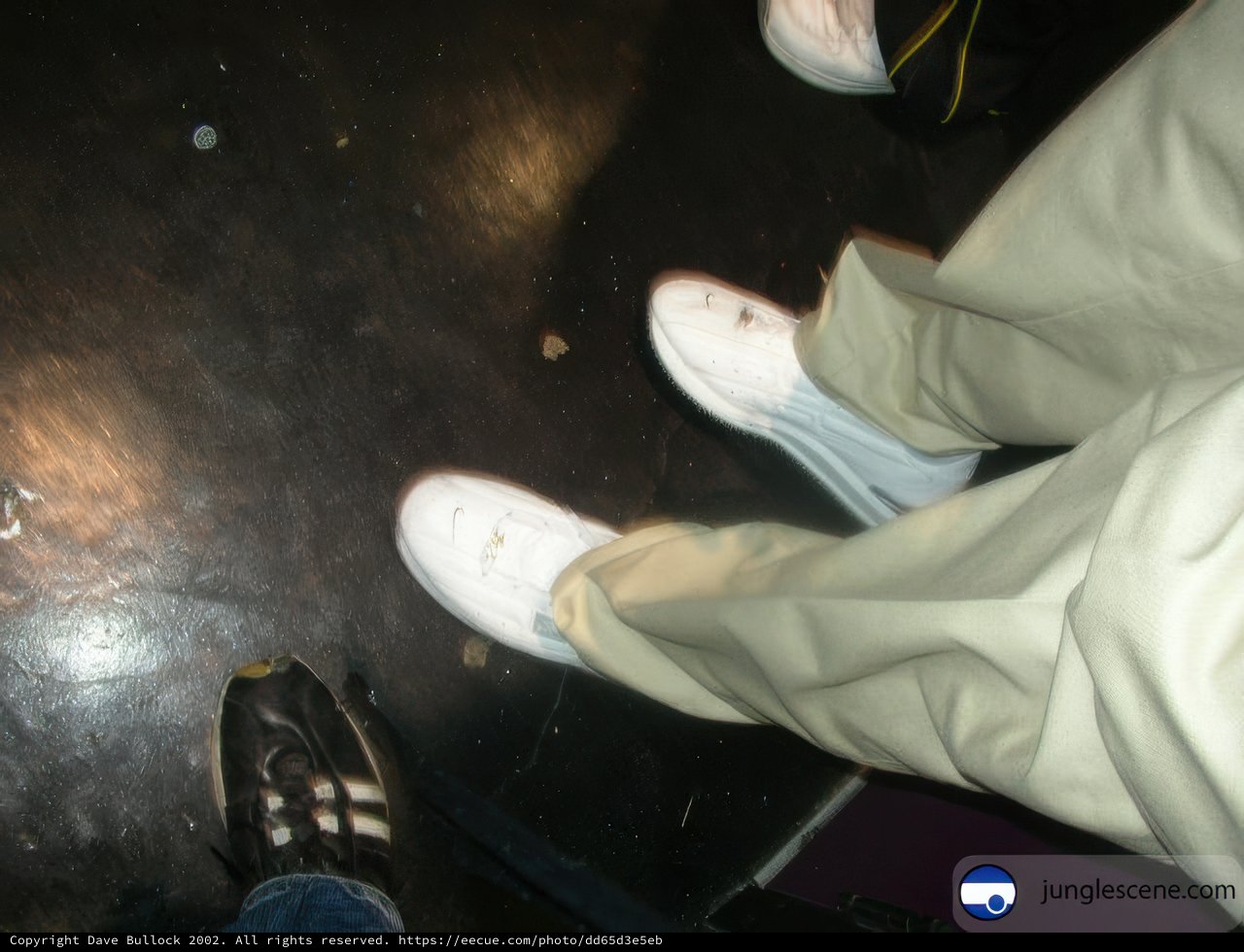 White Sneakers on Black Ground