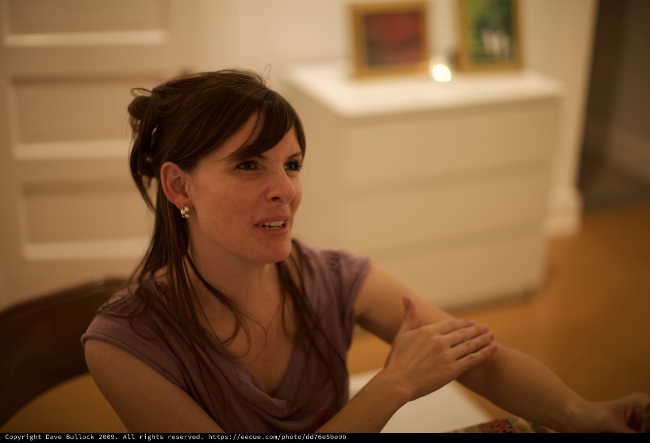 Penelope in Warm Conversation at Gallery Opening