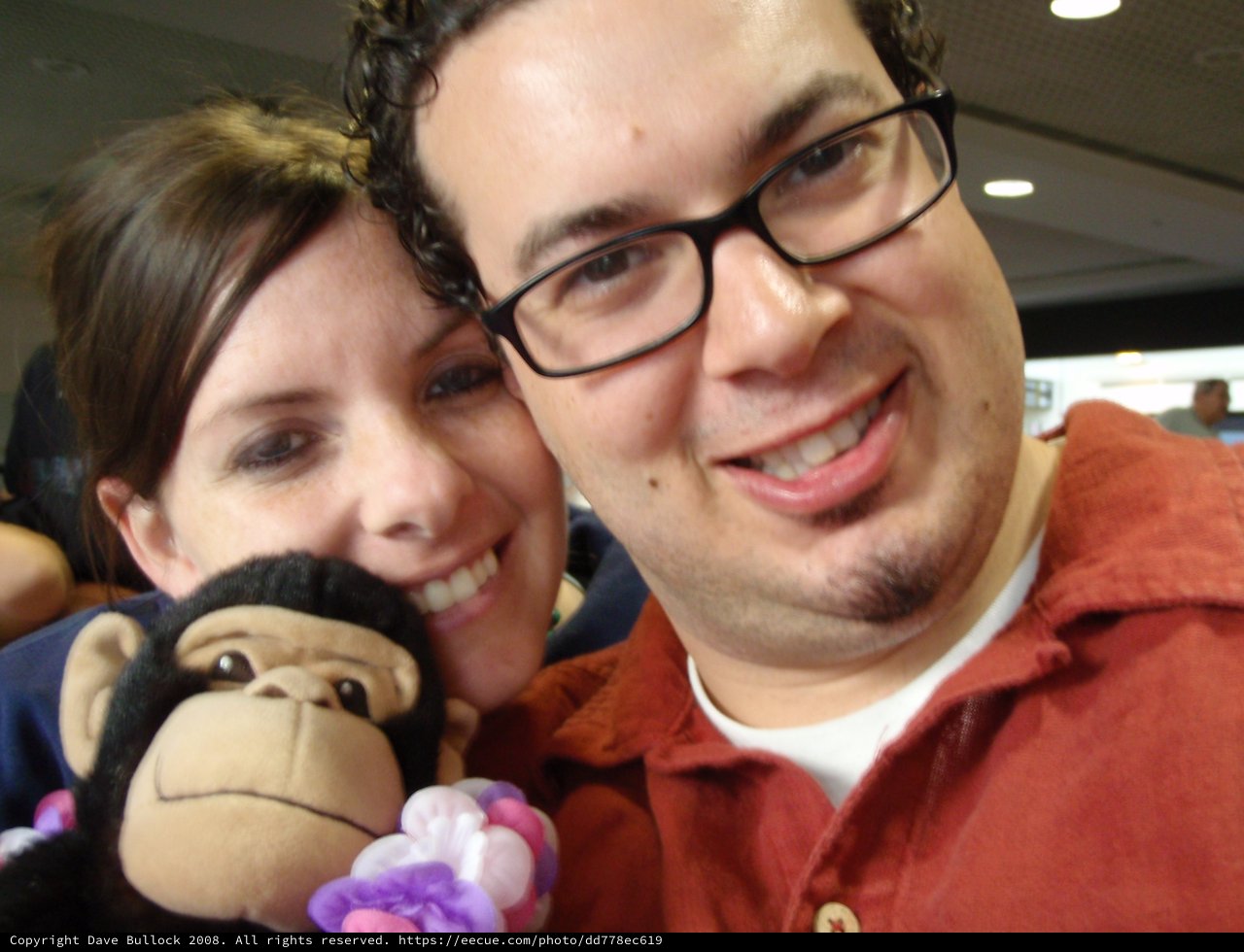 Couple and Monkey Plush Selfie at Airport