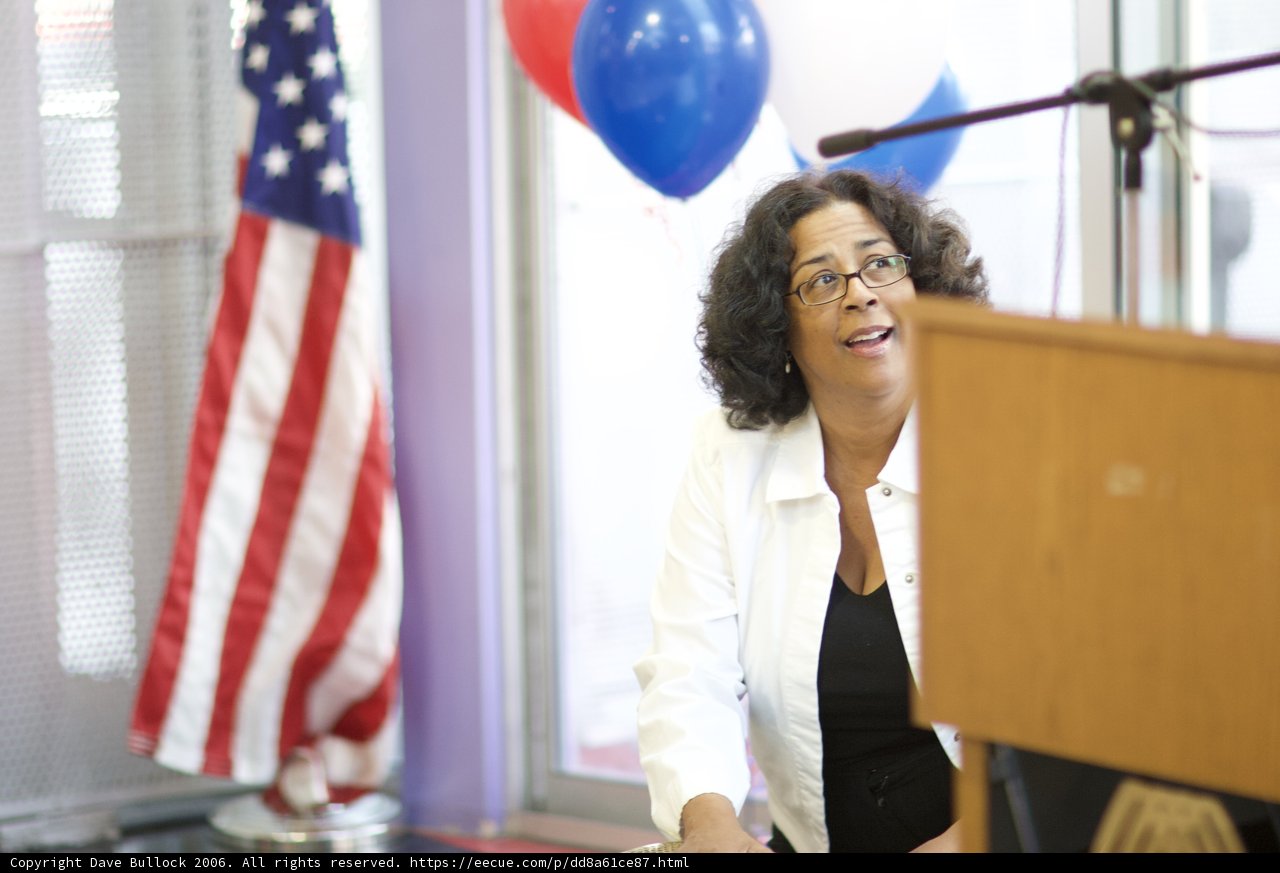 Woman with Balloons at Podium