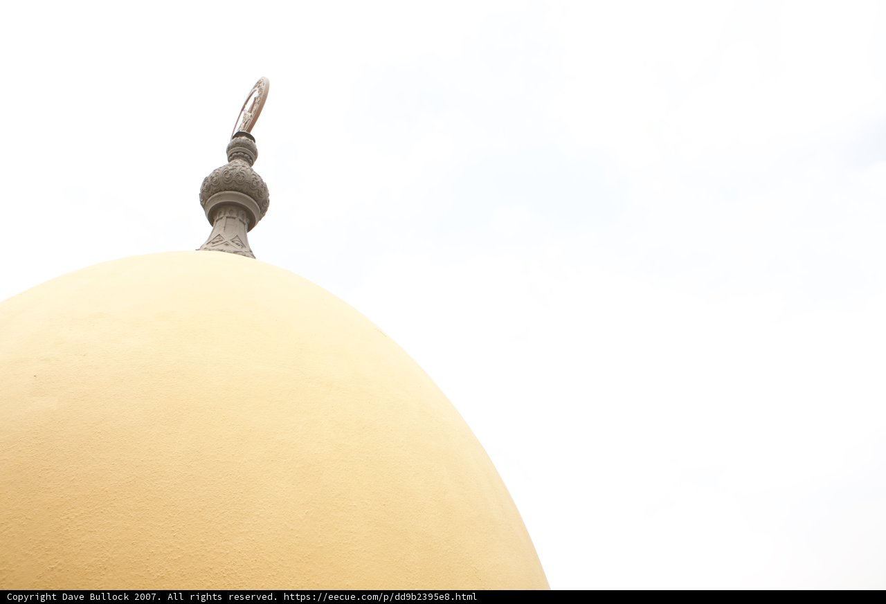 The Majestic Yellow Dome with a White Cross on Top