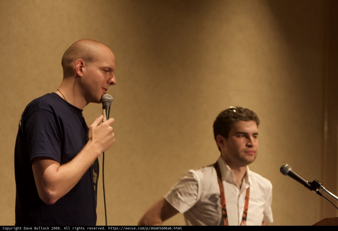 Two Men with Microphones Entertain the Crowd