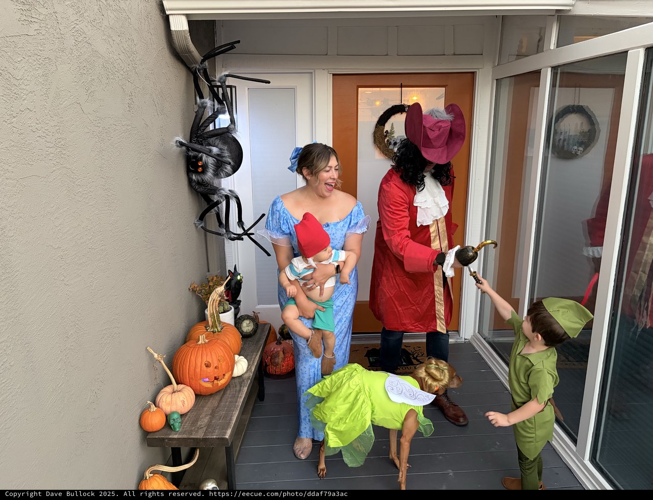 Family Halloween Trick-or-Treating at Front Door
