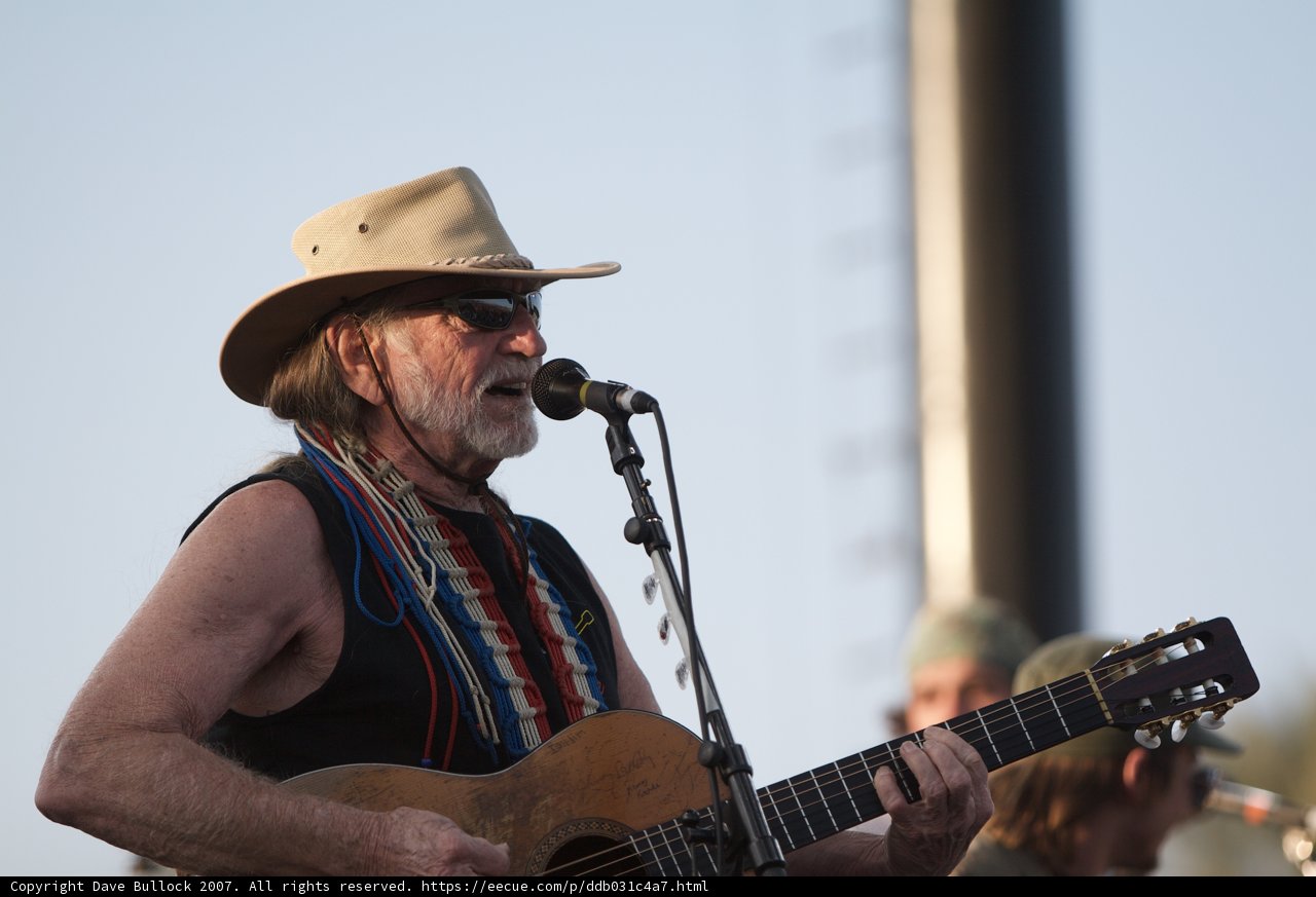 Willie Nelson strums the guitar at Coachella