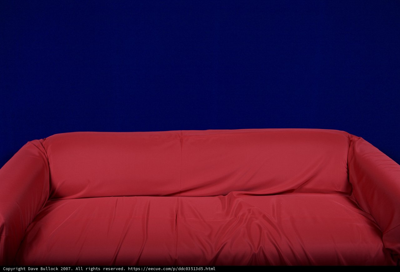 Vibrant Red Couch in Blue Surroundings
