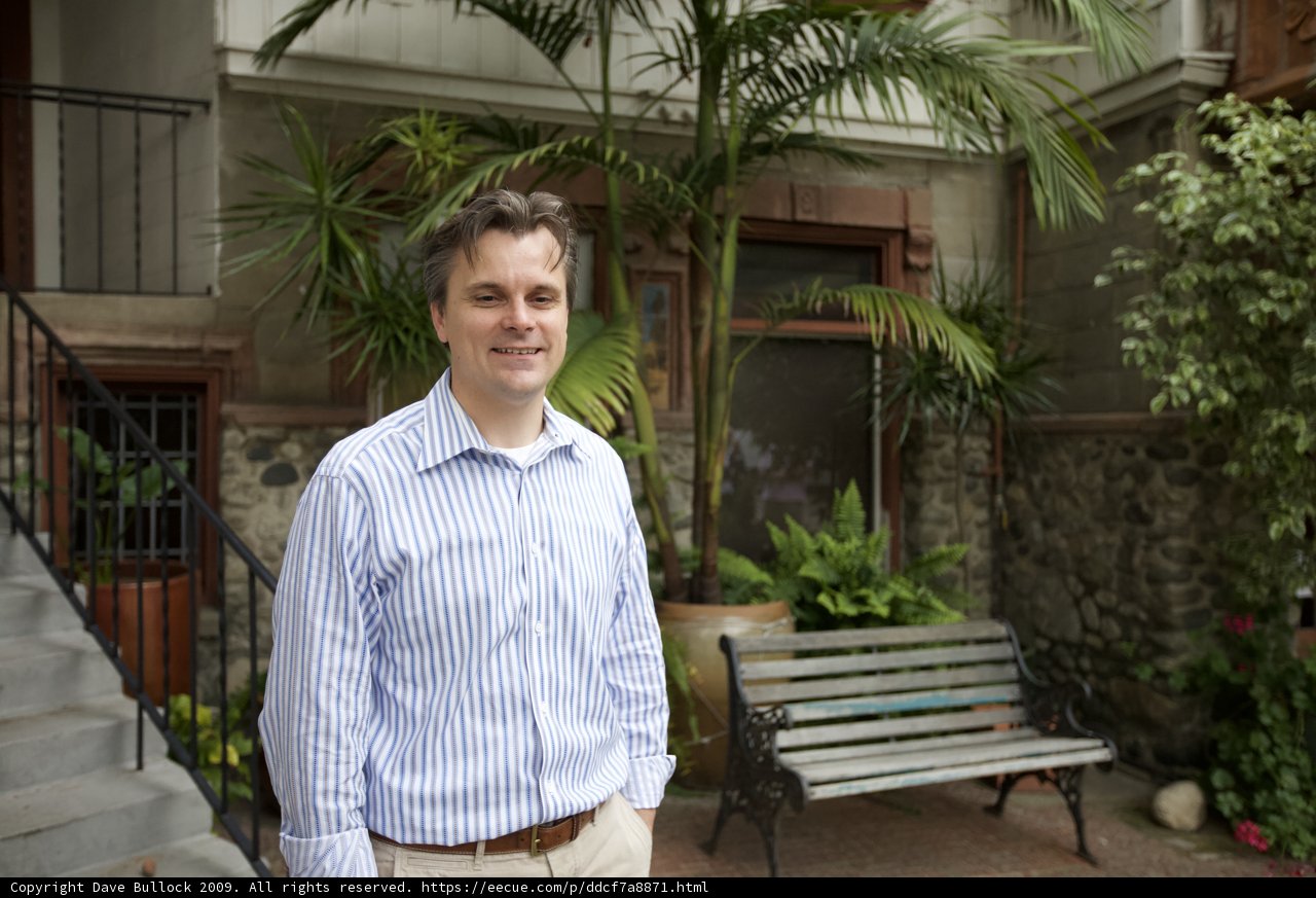 Striped Shirt Man on Garden Bench