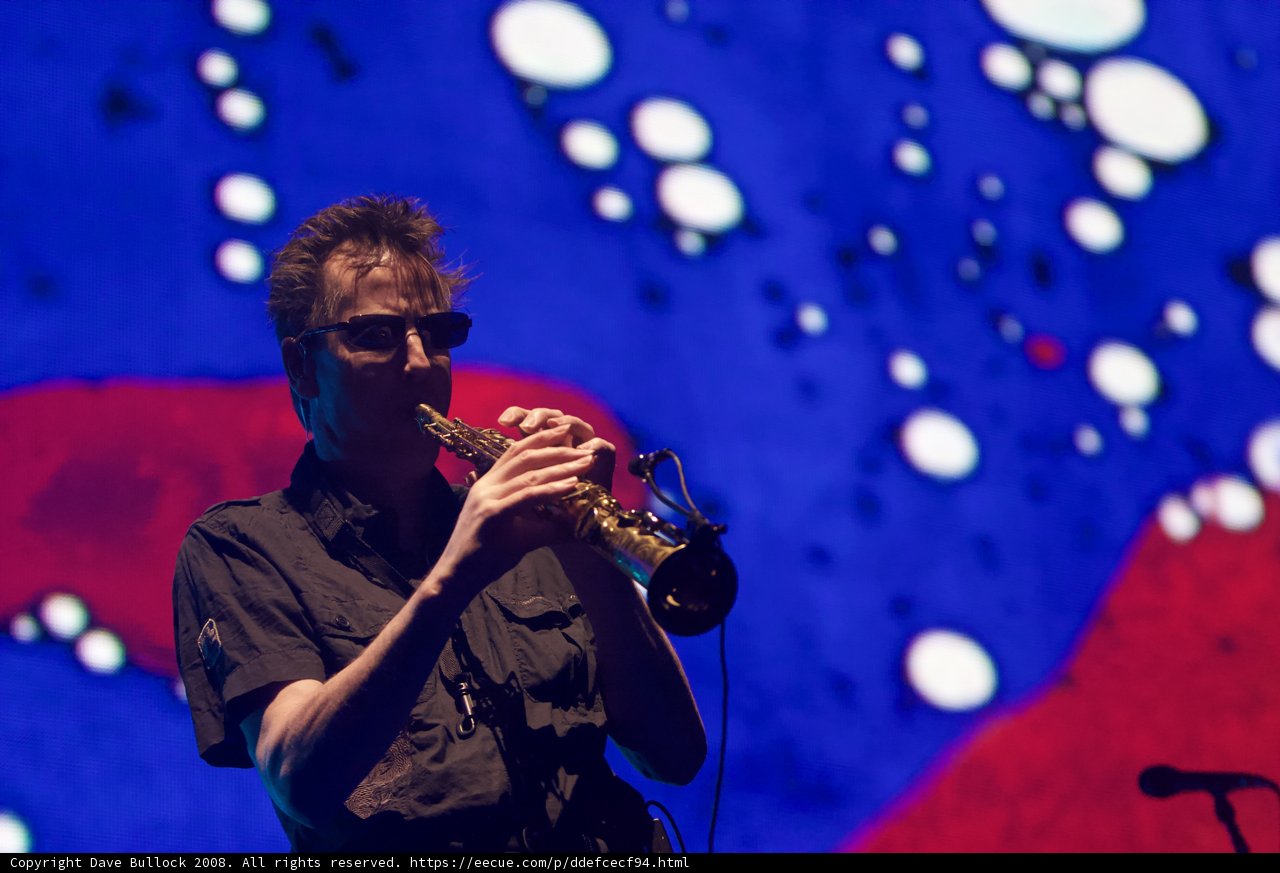 Man in sunglasses plays flugelhorn on Coachella stage