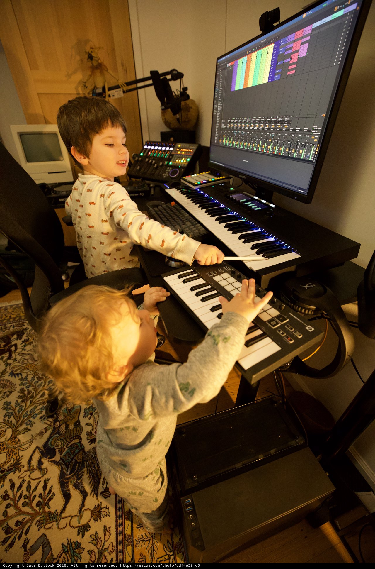 Young Children Making Music in Home Recording Studio