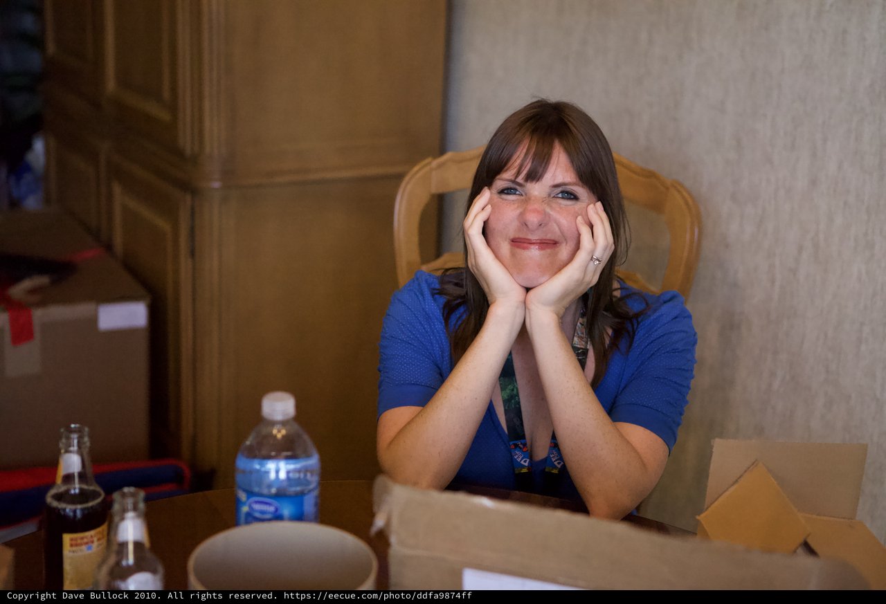 Cheerful Woman at DEF CON 18 Conference Table