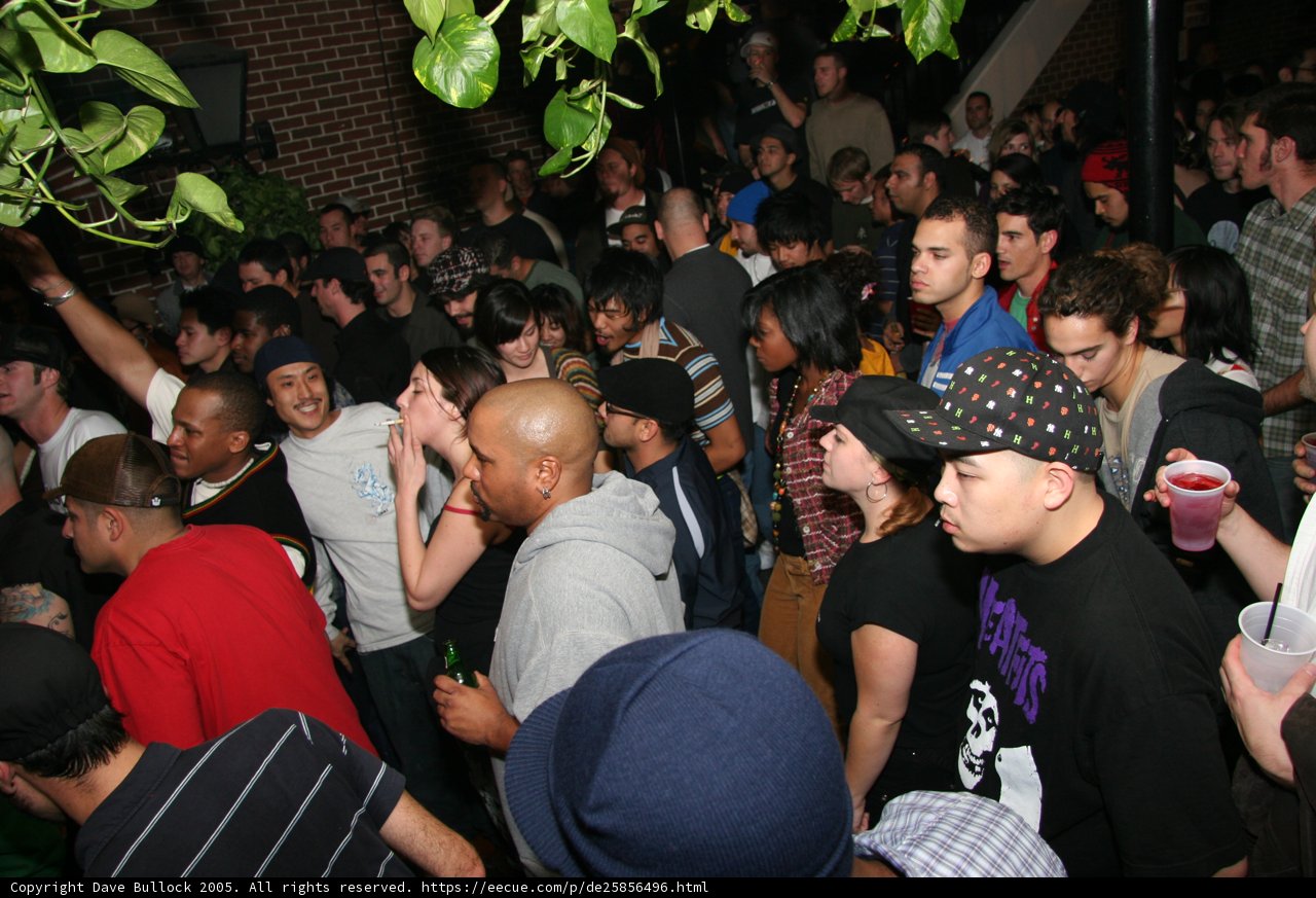 Party Crowd with a Man in Black Shirt