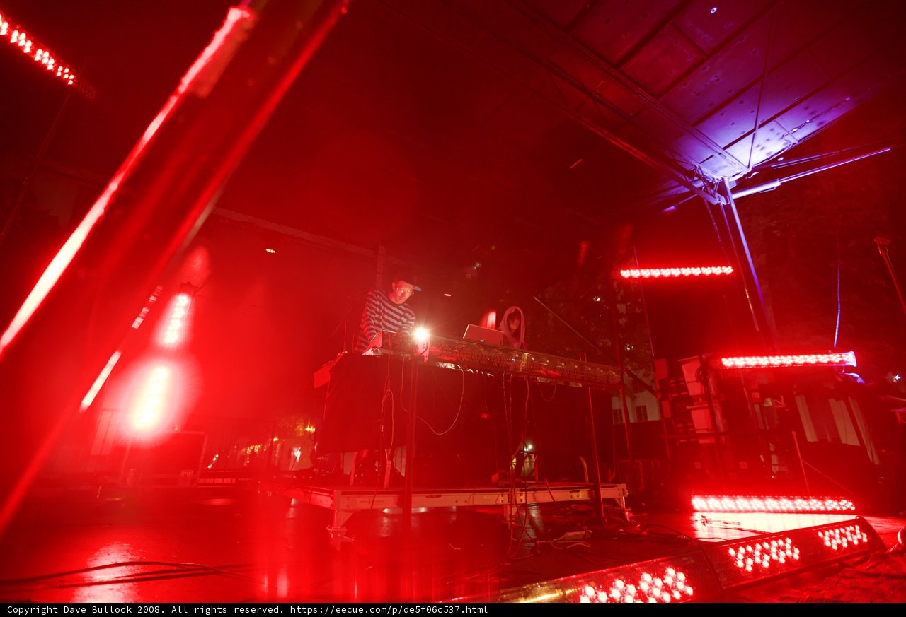 Red Spotlight on Keyboardist during Rock Concert
