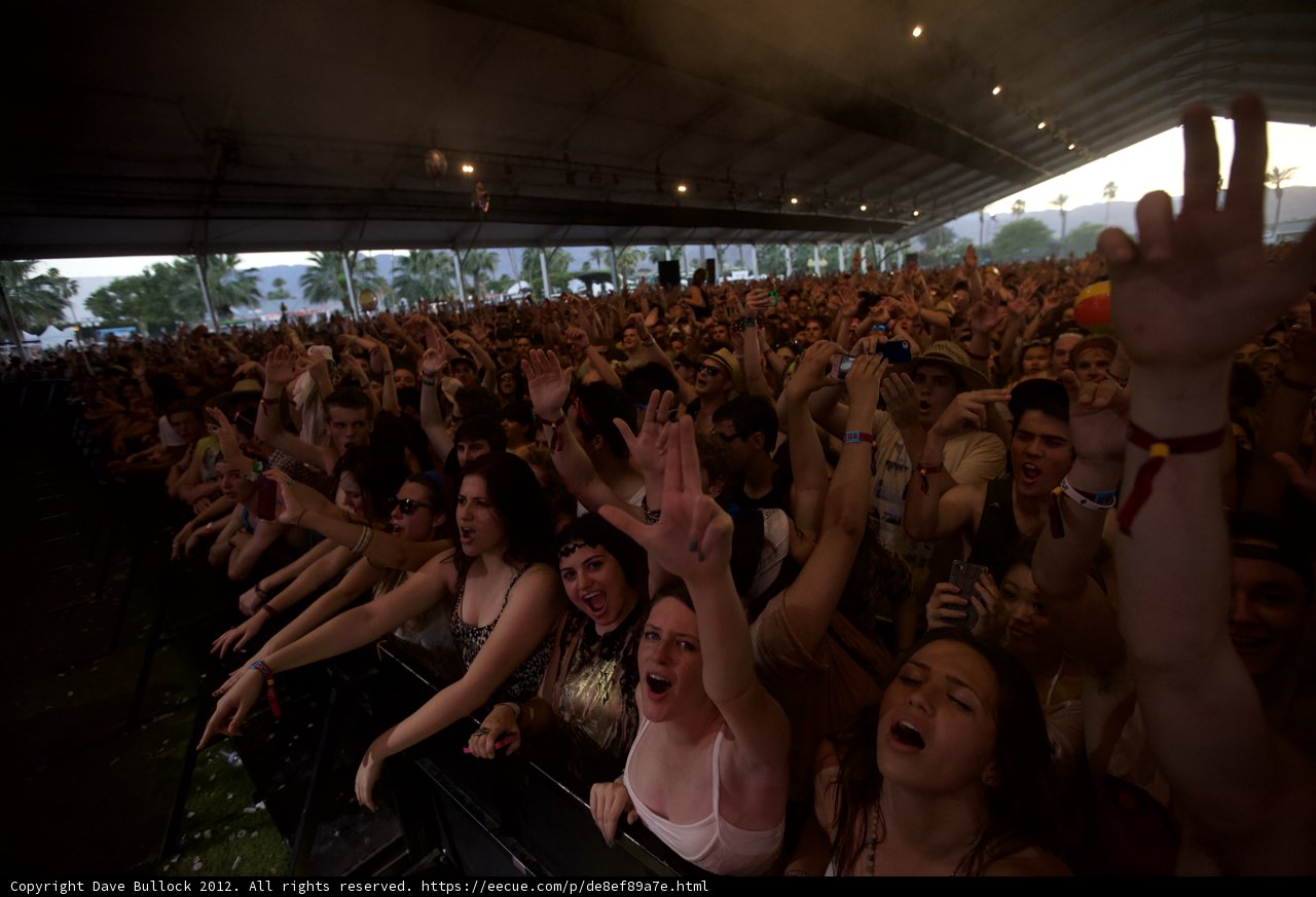 Concertgoers' Hands Up in Excitement