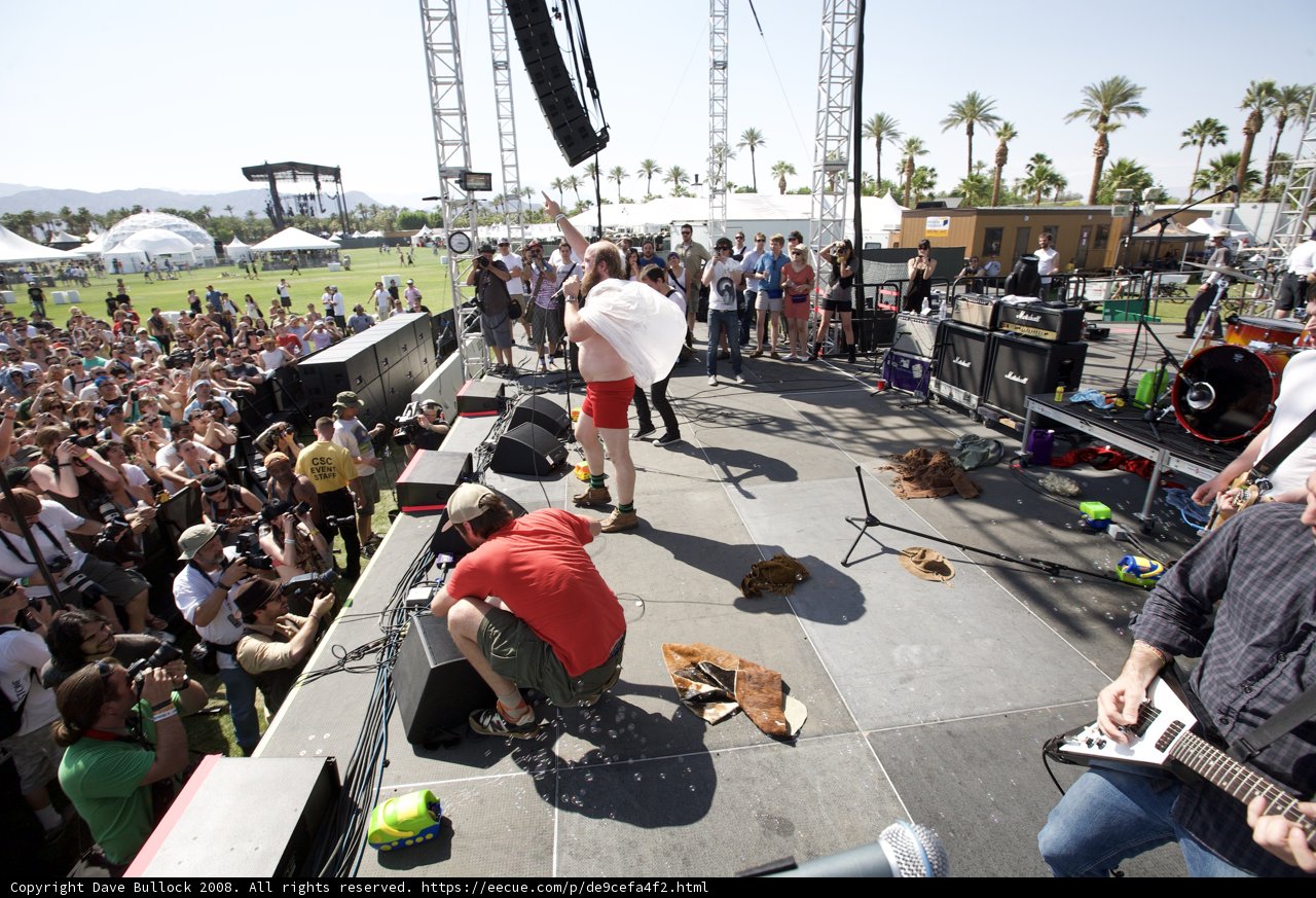 Man in Red Shorts Playing Guitar at Coachella Concert