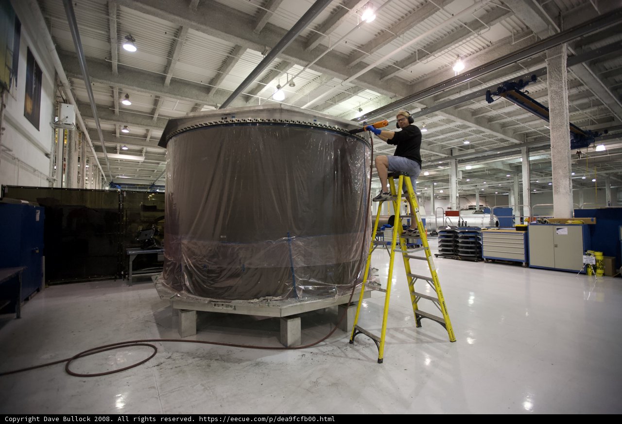 Working on a Large Tank in a Factory