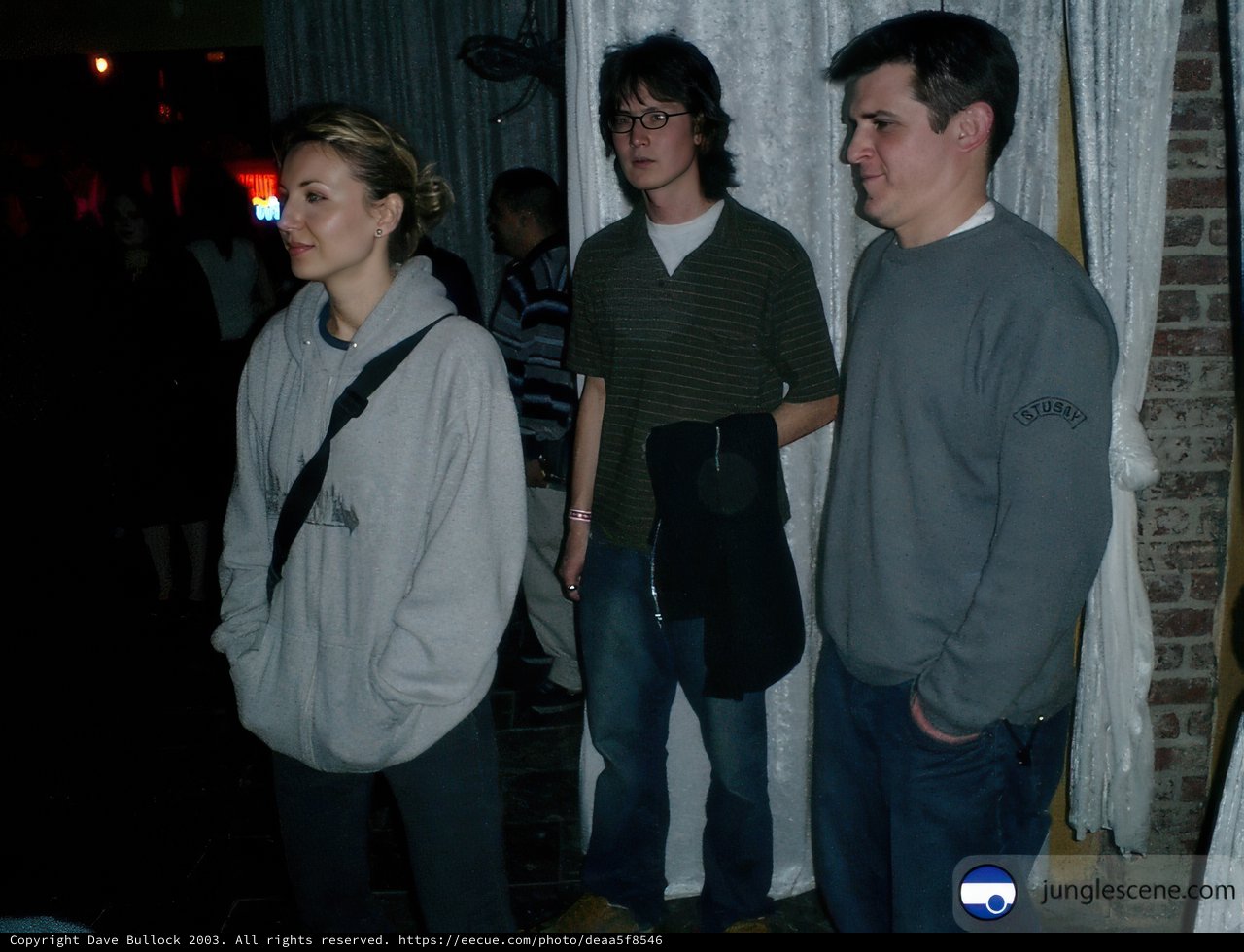 Three Young Men in a Dark Room