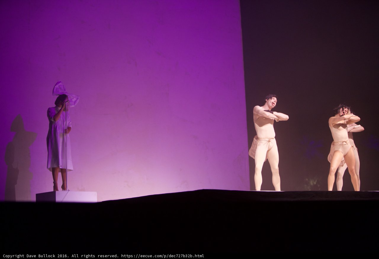 Three Dancers in White Body Suits Take Center Stage