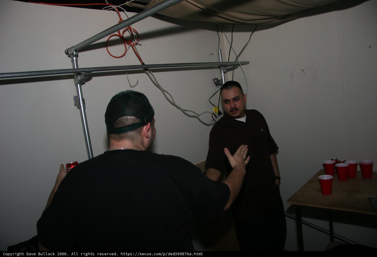 Two Men in a Wood Panel Room