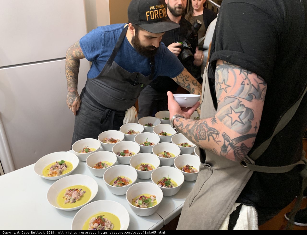 Tattooed Man Indulging in a Delicious Meal