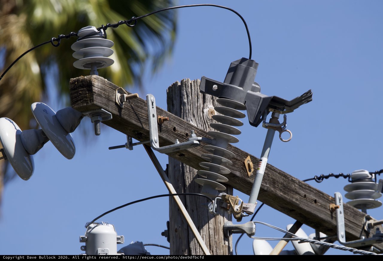 Weathered Electrical Pole with Insulators and Hardware