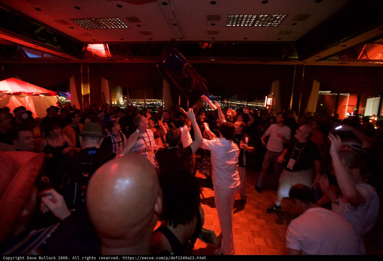 Partygoers Holding Up Red Light at Night Club