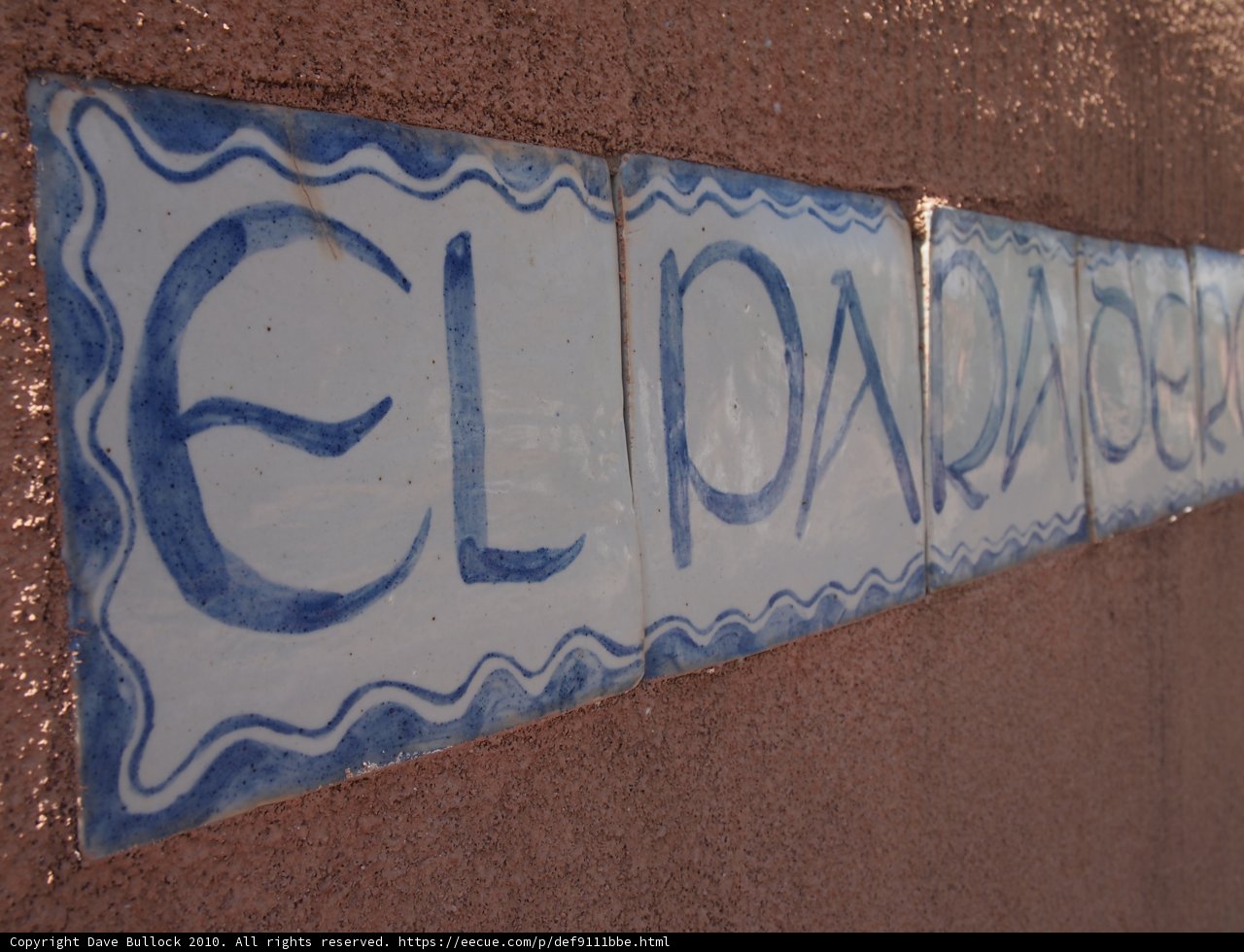 Blue and White Tile Sign on Wall