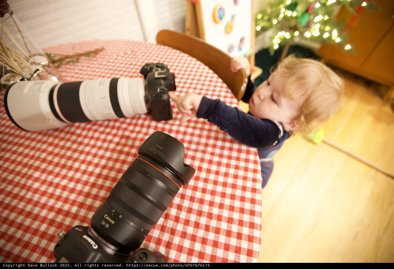 Young Child Napping with Photography Equipment at Christmas