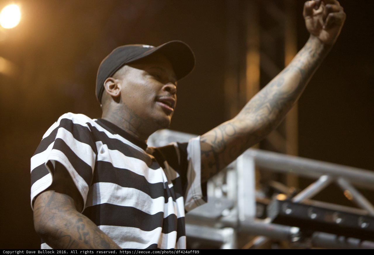 YG showing off his tattoos