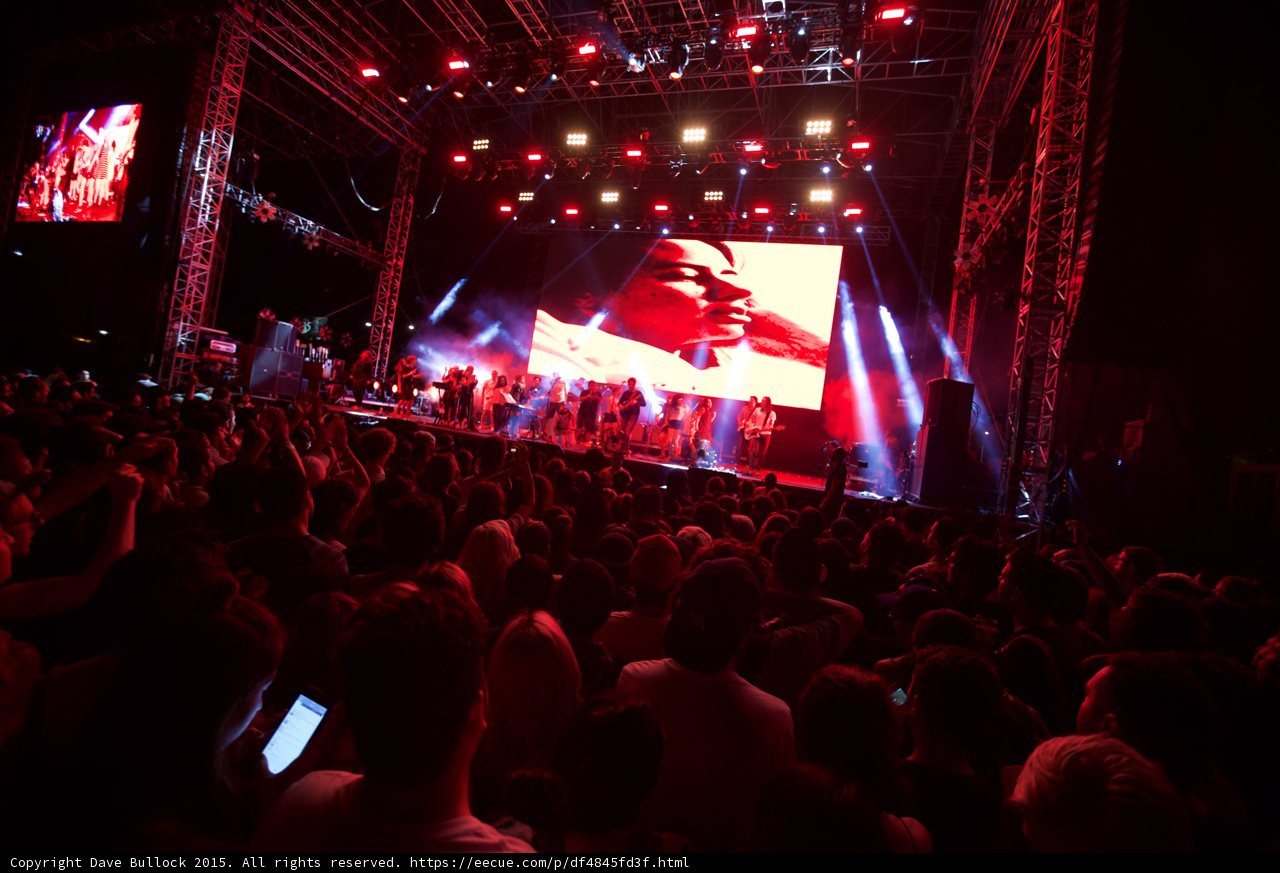 Belle and Sebastian Wide Stage Video Screen Face Red Lighting Spotlight Beams Phone Screens Crowd