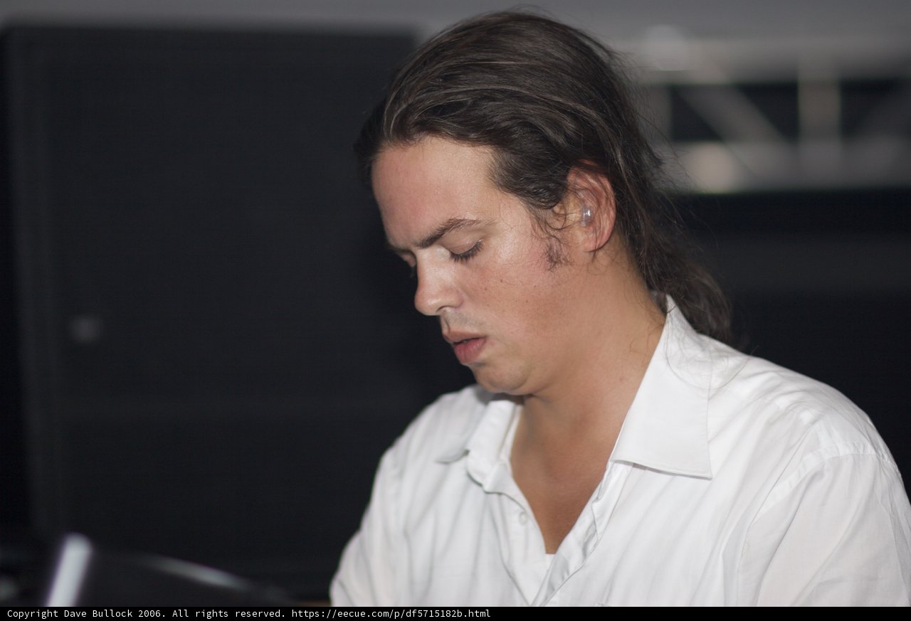 Long-Haired Man in a White Shirt