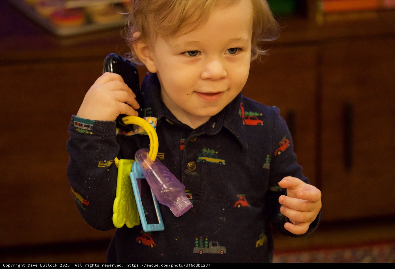 Toddler Playing with Toy Keys and Phone