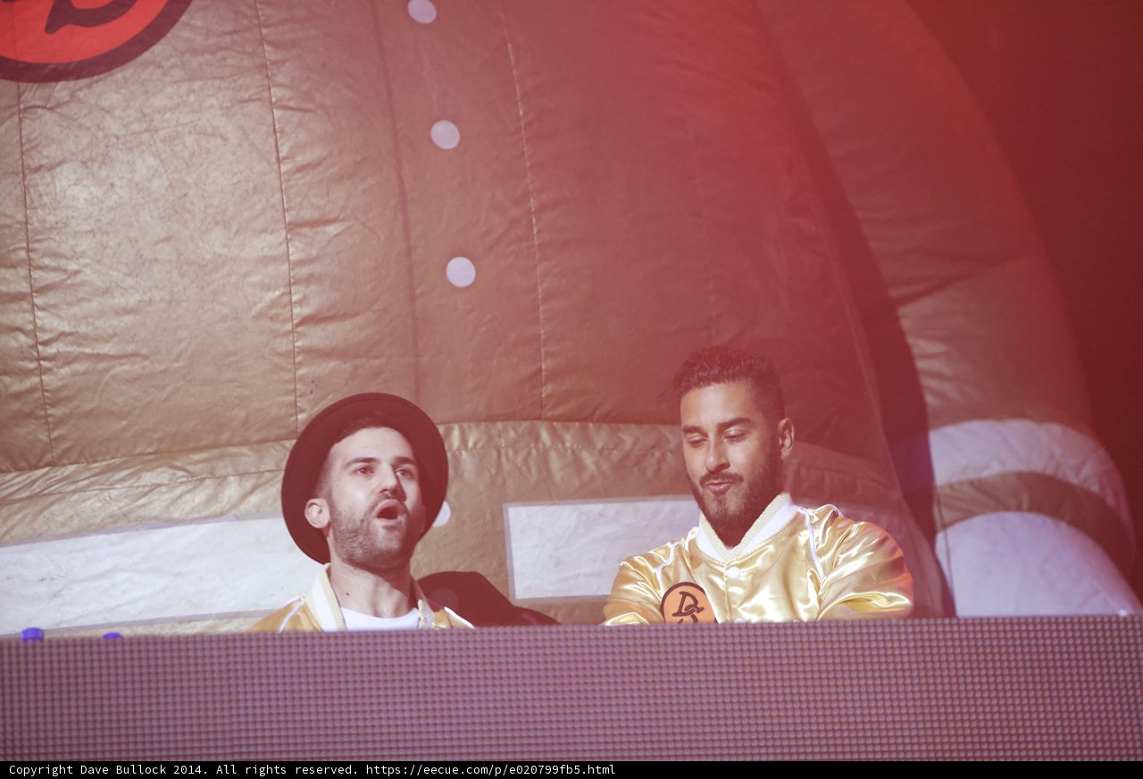 Two Gold Jacketed Men Take the Stage